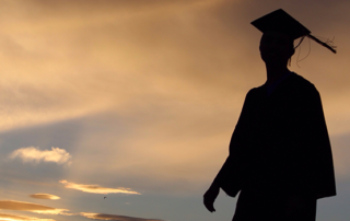 Silhouette of graduate in cap and gown